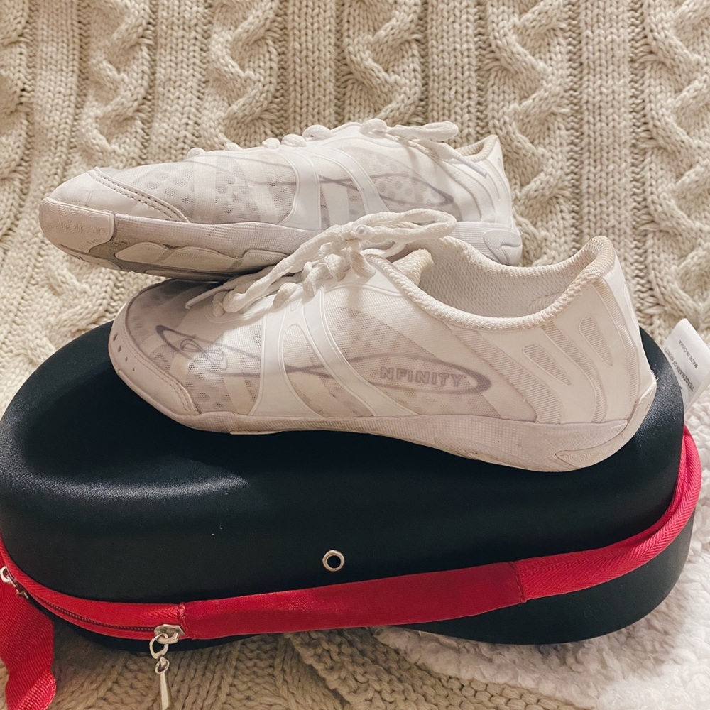 White NFINITY cheer shoes, women’s size 9. Worn for half a season.